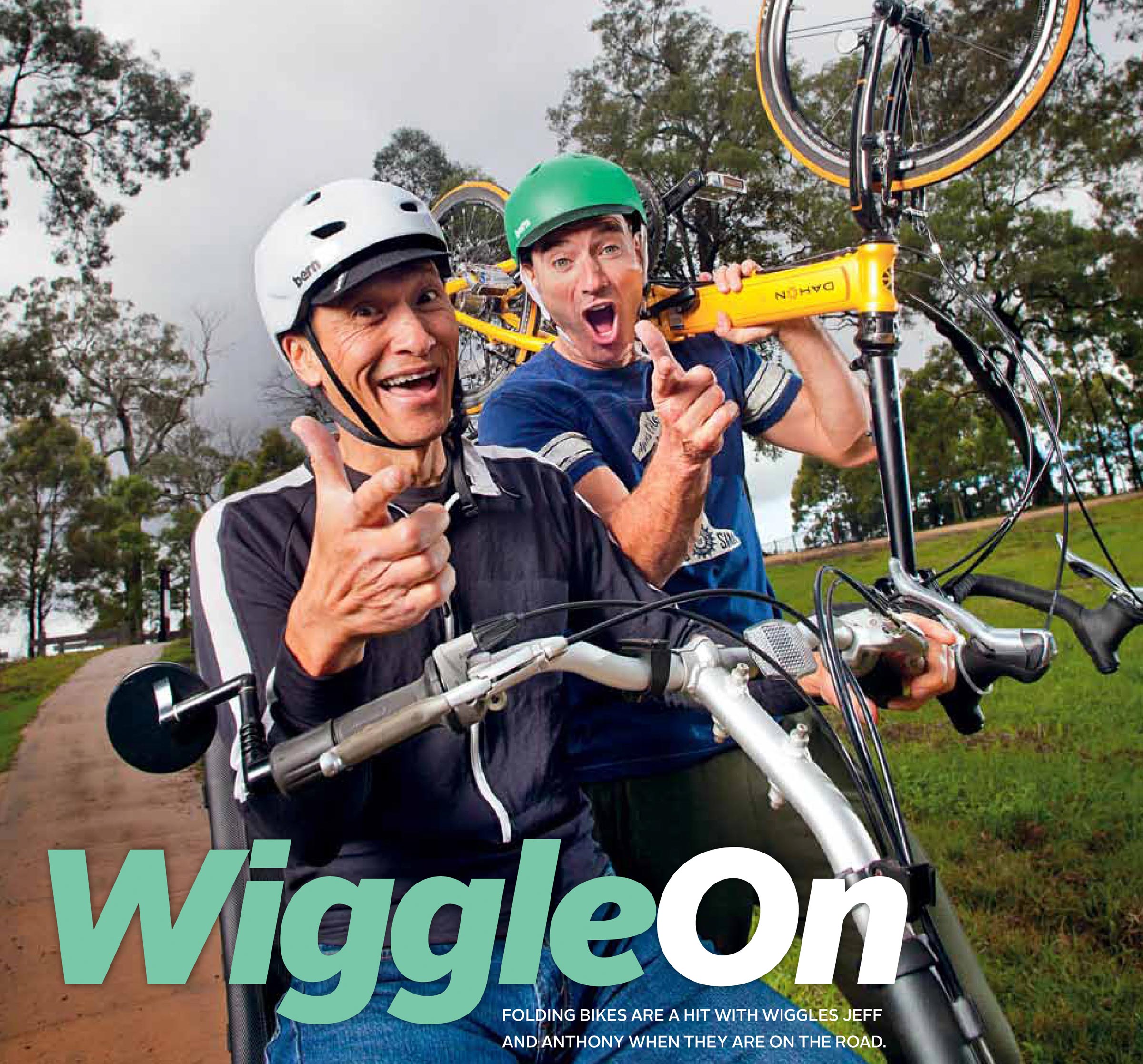 Location editorial photography of Jeff and Anthony Wiggles in a park holding bicycles pointing at camera